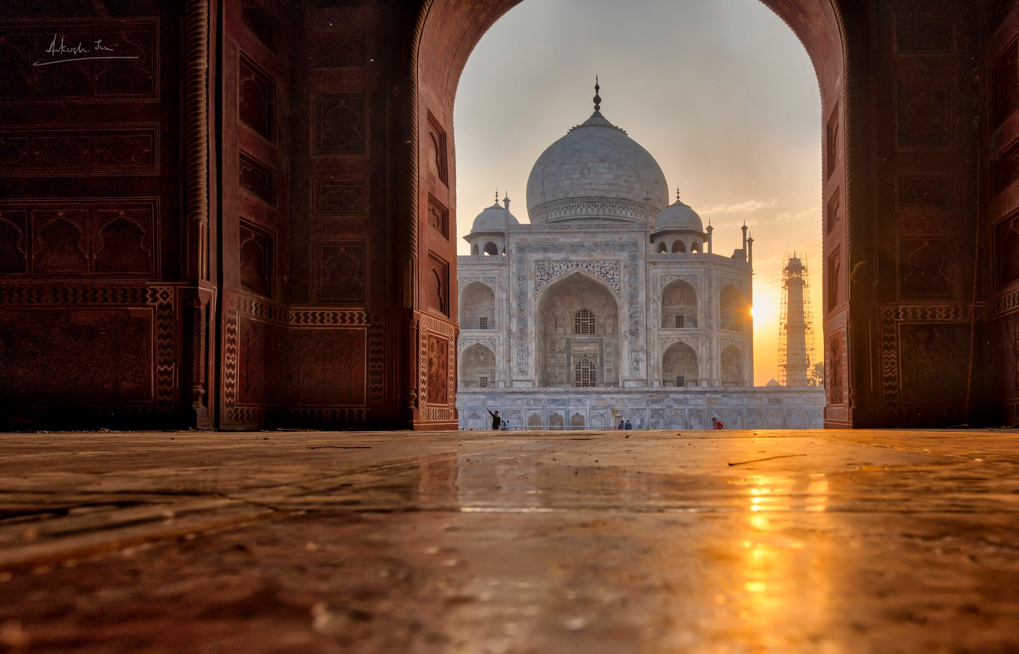 Taj Mahal framed by the great gateway arch on a March sunrise