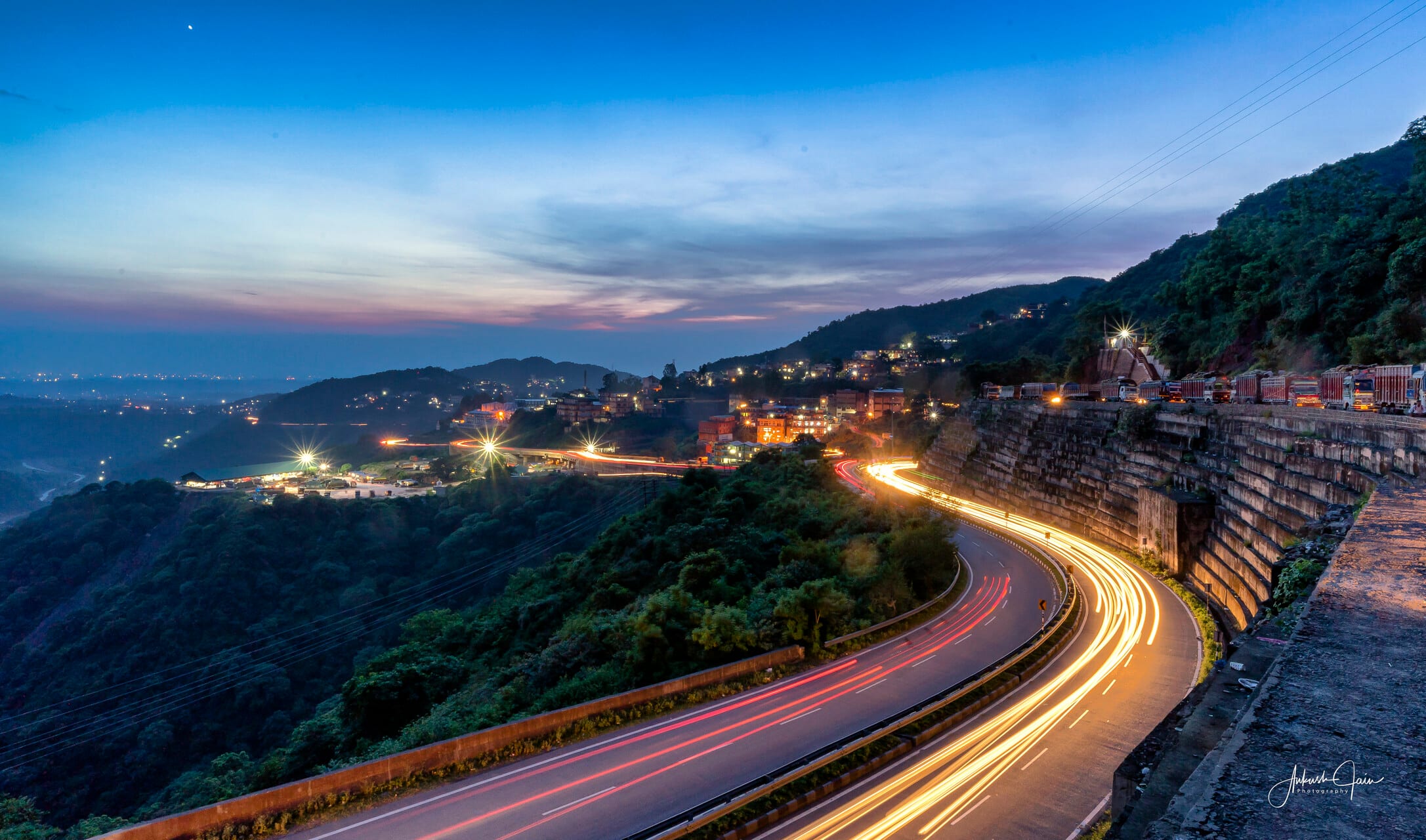 Light trails curving along the Kalka–Shimla highway at dusk