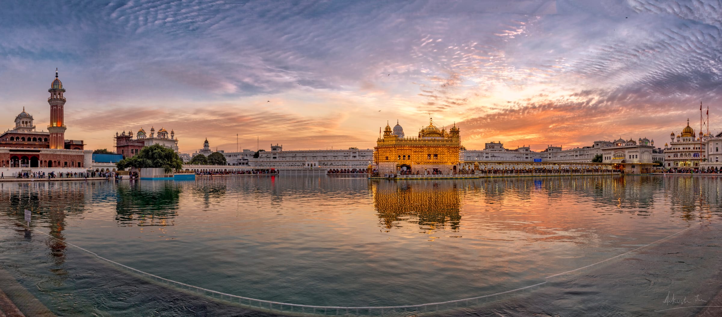 Panorama of Harmandir Sahib across the sarovar at sunset