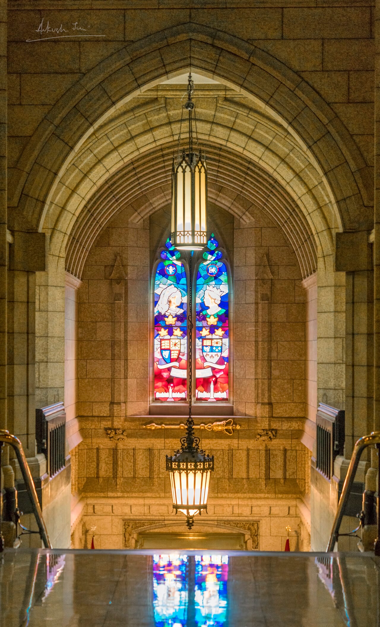 Stained glass window and gothic arch inside the Library of Parliament, Ottawa