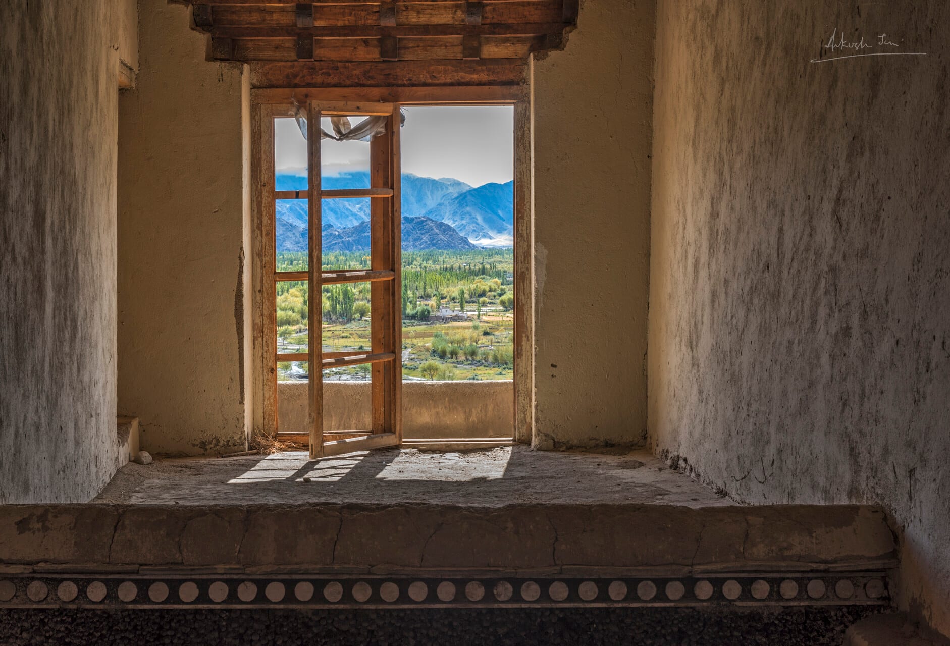 Doorway from inside an old cell at Shey Palace looking out to the Indus valley