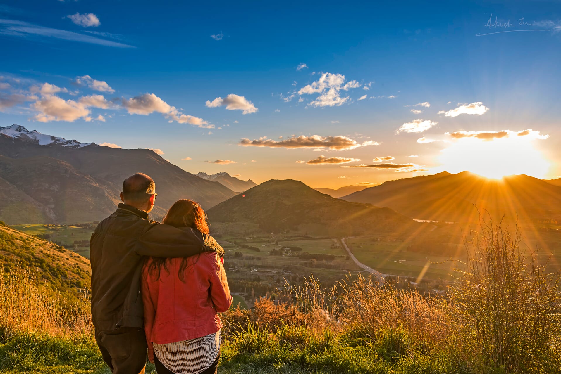 Watching the sunset with my wife from a hilltop near Queenstown, rolling valley below